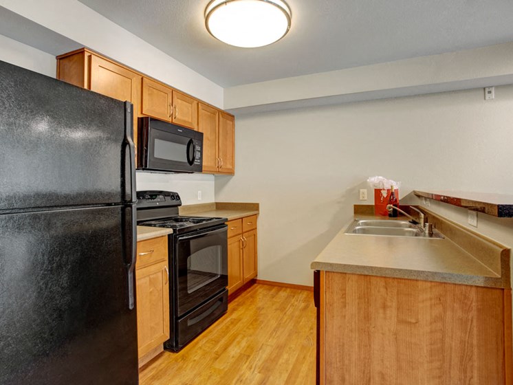 Kitchen with Black Appliances | Apartments In Shoreline WA | Echo Lake